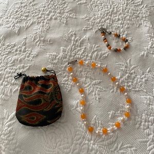 Necklace with bracelet and pouch